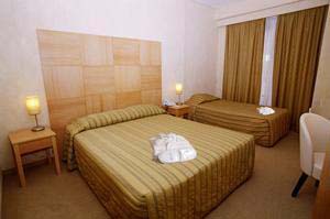 Standard triple with city view, private facilities (shower), and breakfast